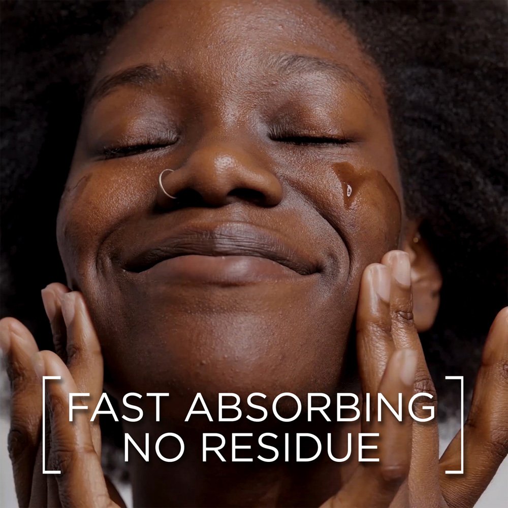 Close-up of woman applying garnier skin naturals serum with fast absorbing no residue