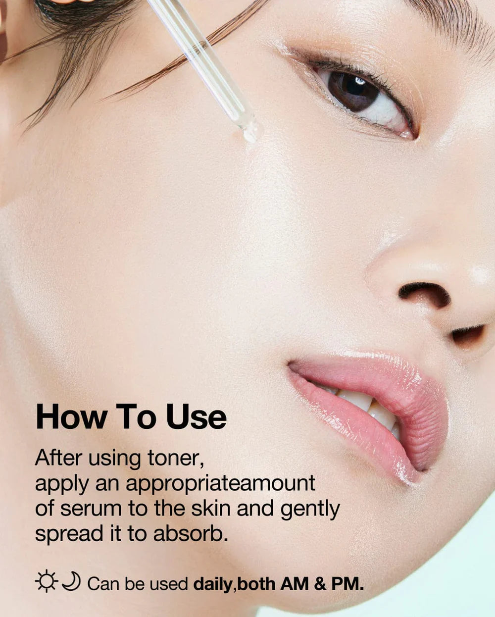 Close-up of woman applying Anua Niacin Hyaluronic Serum drop to her cheek for skincare routine