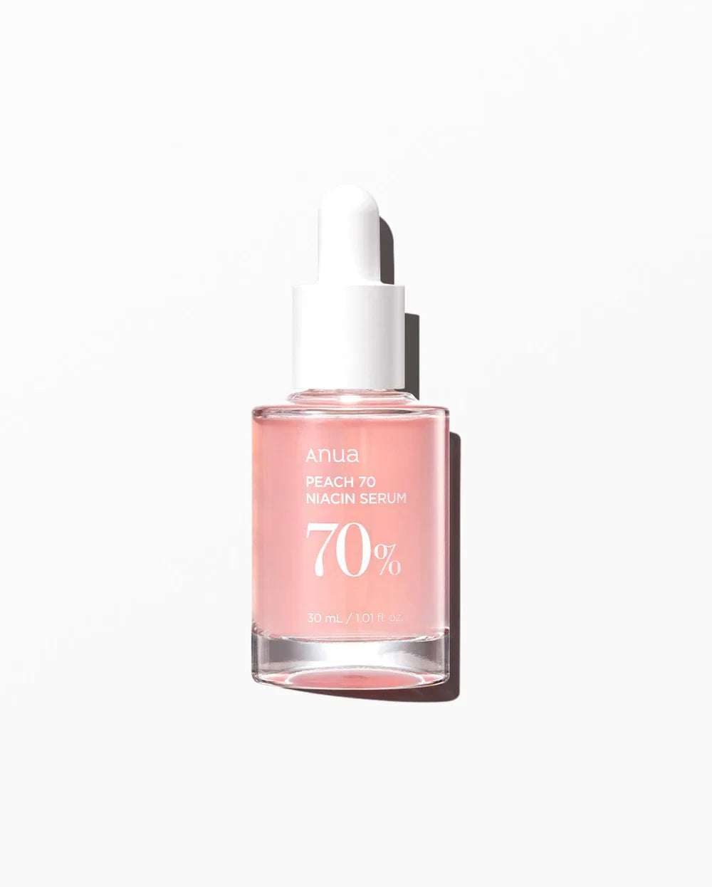 Anua Niacin Hyaluronic Serum bottle with peach pink liquid and white dropper cap