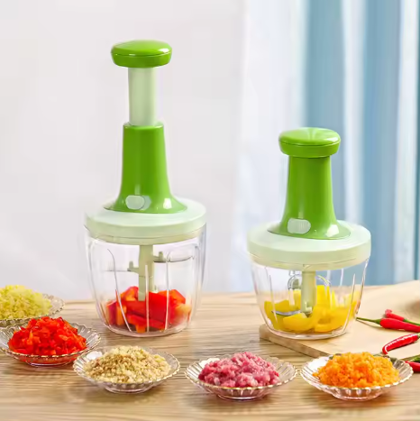 Souqzila handheld food chopper set with green tops chopping various vegetables and ingredients