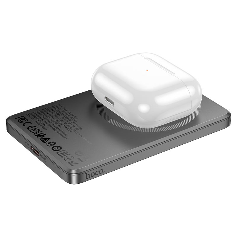 Souqzila Hoco Q26 slim gray fast charging wireless power bank showing white earbud case charging on top