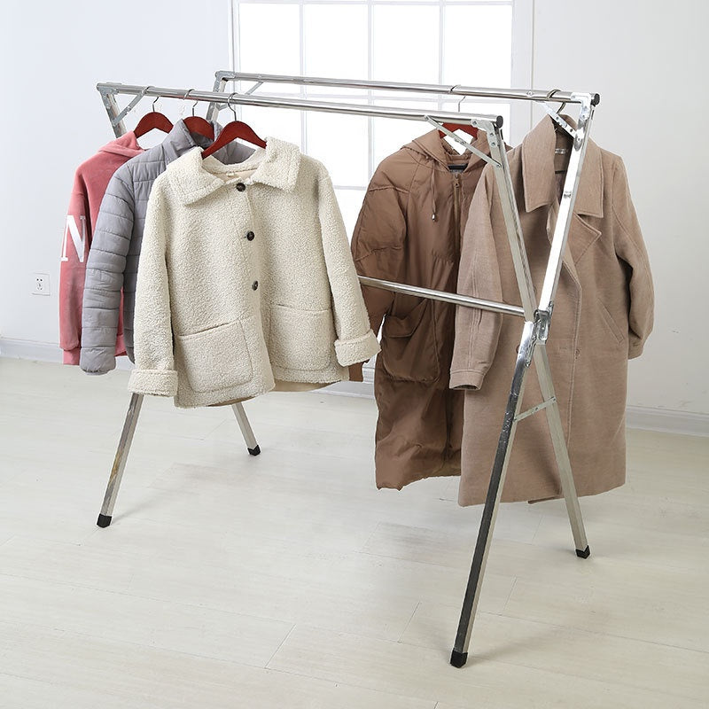 Souqzila retractable stainless steel indoor clothes drying stand with jackets hanging in a bright room