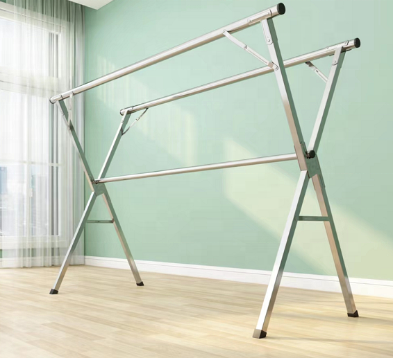 Souqzila retractable stainless steel indoor clothes drying stand in a bright room with green walls