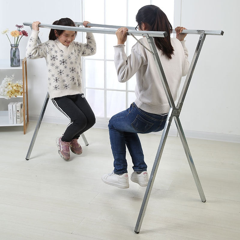 Souqzila retractable stainless steel indoor clothes drying stand with two people playing around it