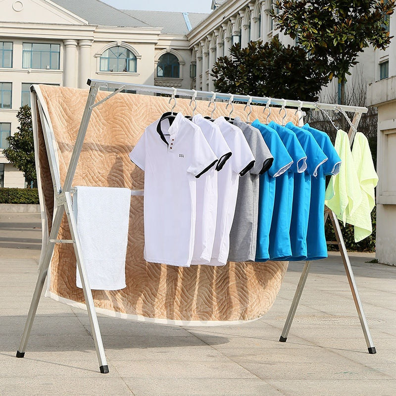 Souqzila retractable stainless steel indoor clothes drying stand with shirts and towels drying outdoors