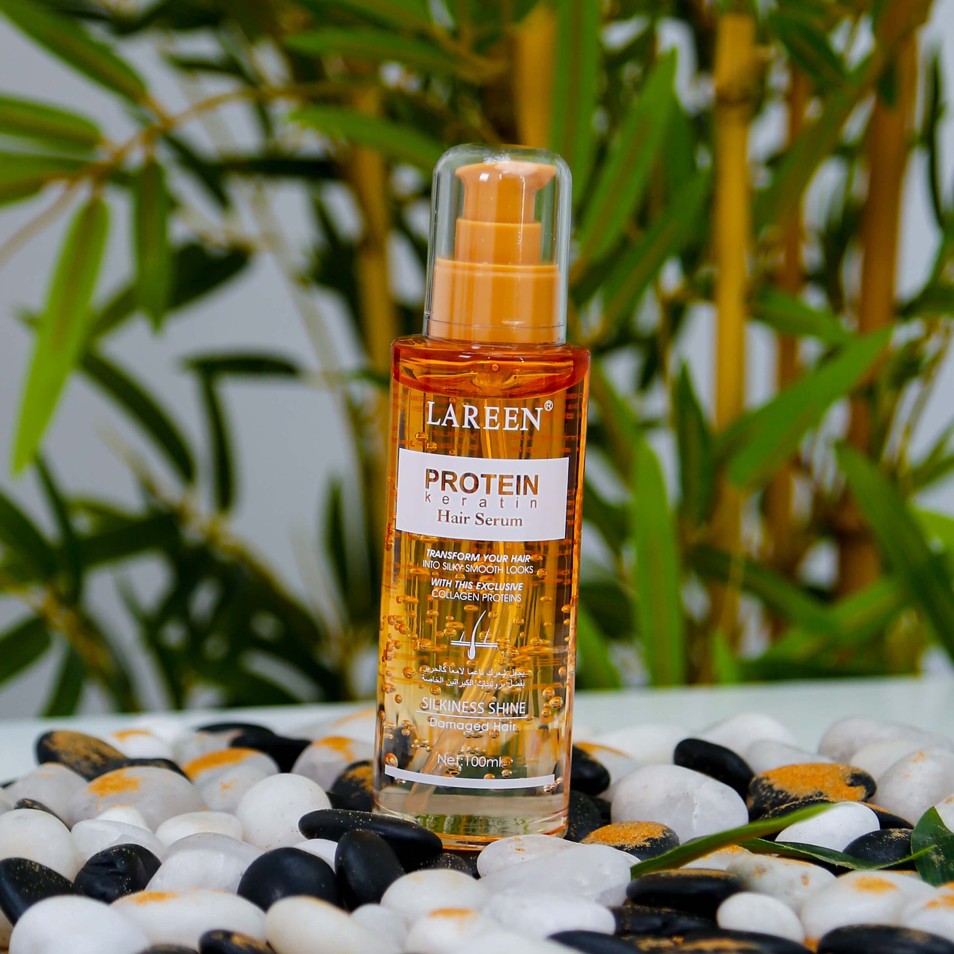 Lareen Hair Serum bottle labeled protein keratin best hair growth serum on decorative stones