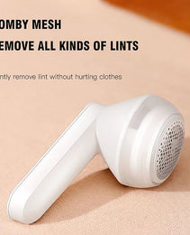 White Souqzila portable lint remover trimmer with comb mesh for gentle lint removal on clothes
