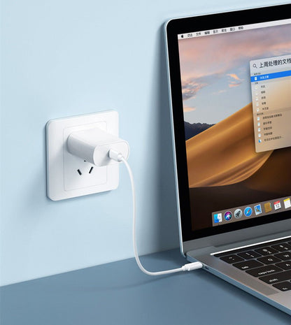 Souqzila 60W fast charging cable connecting white wall adapter to MacBook laptop for fast power delivery