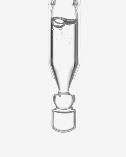 Close-up of clear liquid hyaluronic acid serum in a transparent ampoule for ultra hydration