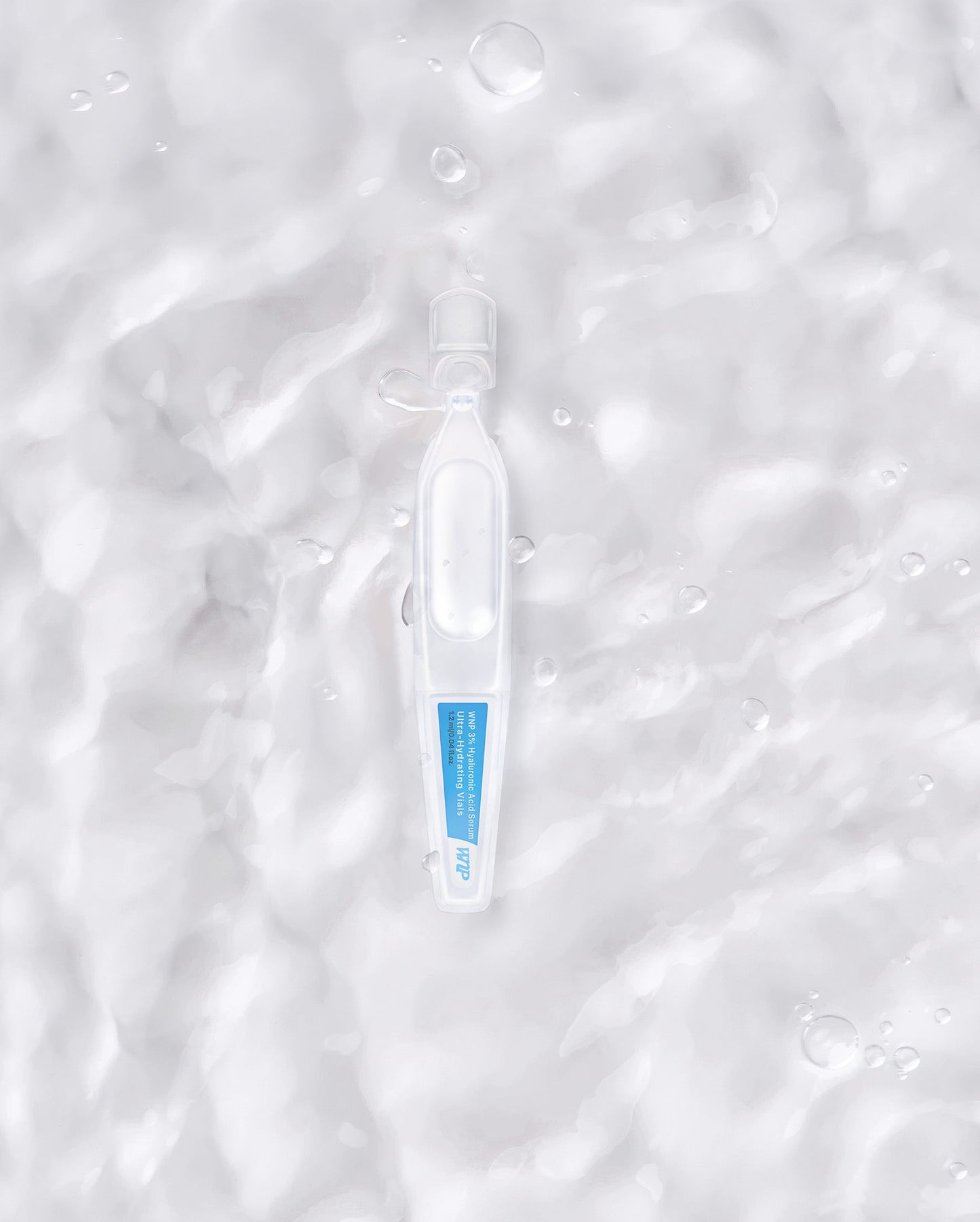 Souqzila ultra-hydrating hyaluronic acid serum ampoule on textured water surface background