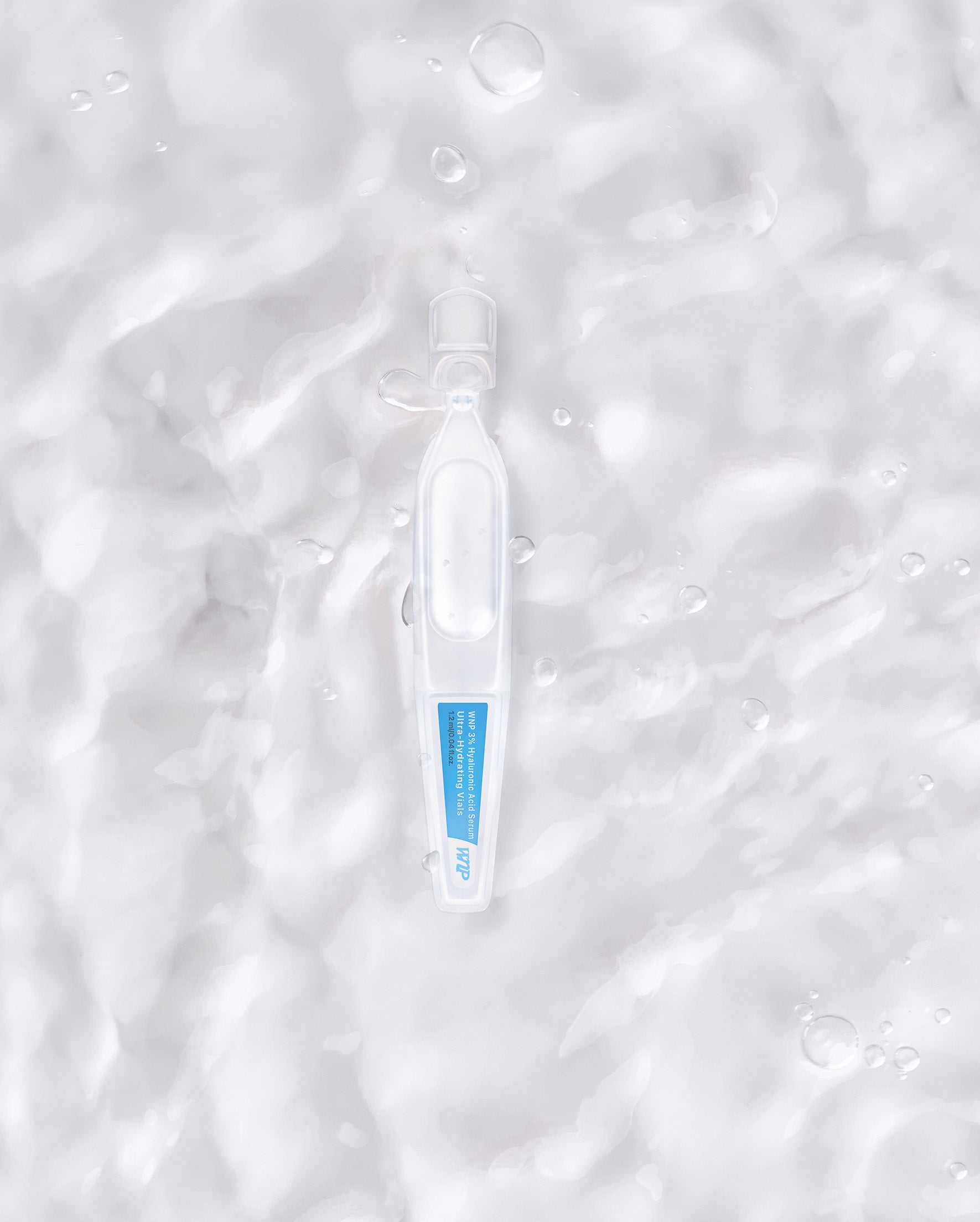 Souqzila ultra-hydrating hyaluronic acid serum ampoule on textured water surface background